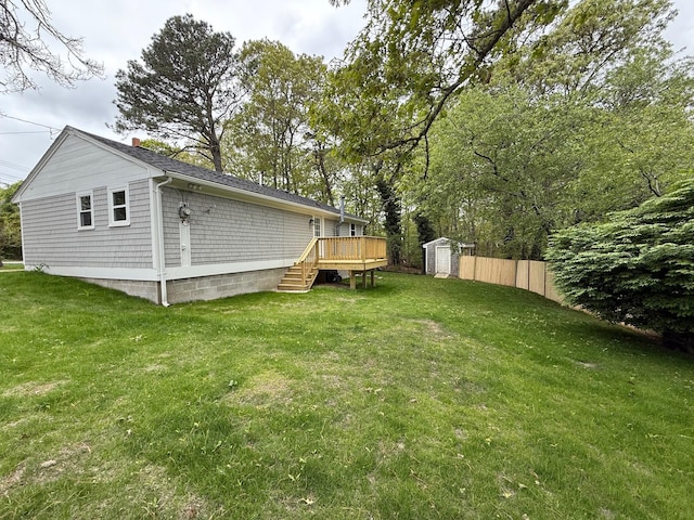view of yard with a deck and stairs