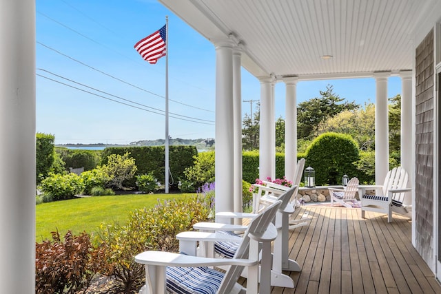 88 Champlain Rd, Chatham, MA 02633 - wooden porch with a yard
