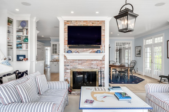 88 Champlain Rd, Chatham, MA 02633 - living area featuring crown molding, a brick fireplace, light wood-style flooring, and recessed lighting