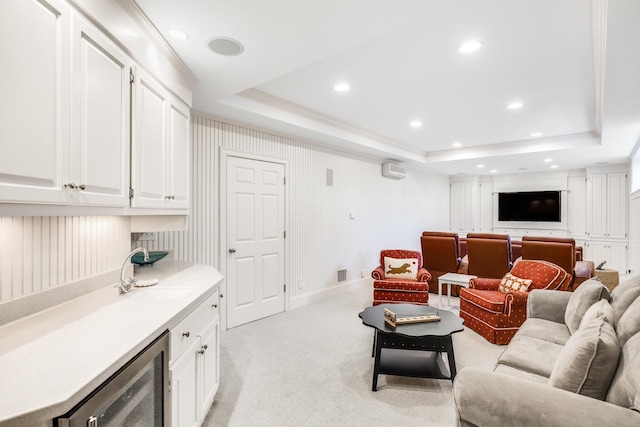 88 Champlain Rd, Chatham, MA 02633 - living room with wine cooler, a tray ceiling, recessed lighting, a wall mounted AC, and light carpet