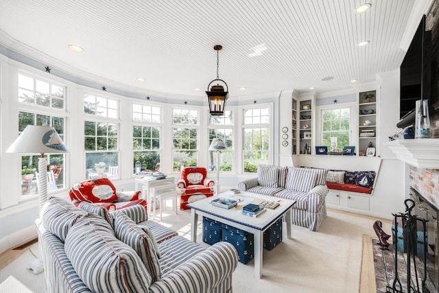 88 Champlain Rd, Chatham, MA 02633 - living area with ornamental molding, a fireplace with flush hearth, and recessed lighting