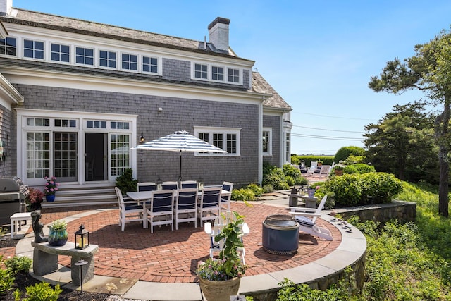 88 Champlain Rd, Chatham, MA 02633 - back of house featuring a patio and a chimney