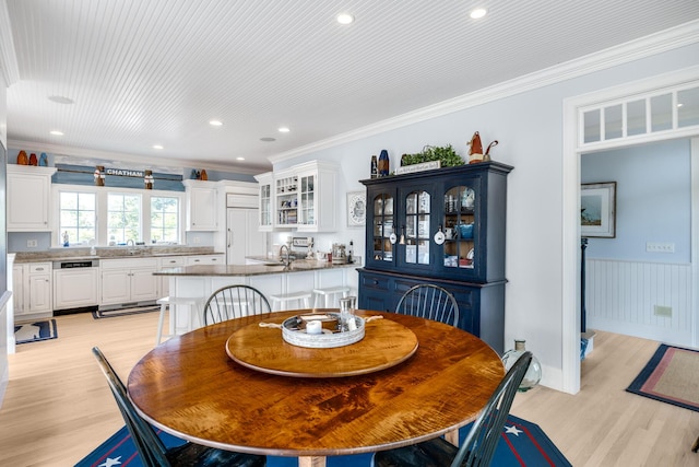 88 Champlain Rd, Chatham, MA 02633 - dining room with light wood-style floors, crown molding, wainscoting, and recessed lighting
