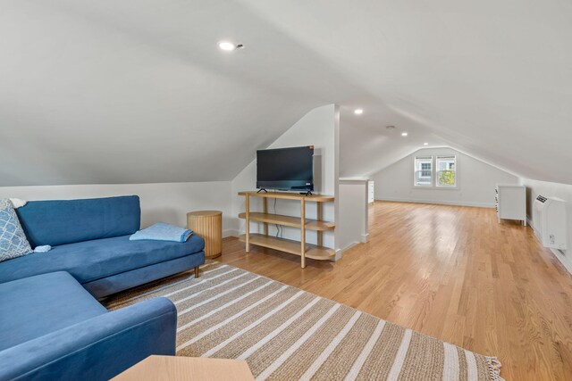 72 Forest Beach Rd, South Chatham, MA 02659 - living area featuring light wood finished floors, vaulted ceiling, and baseboards