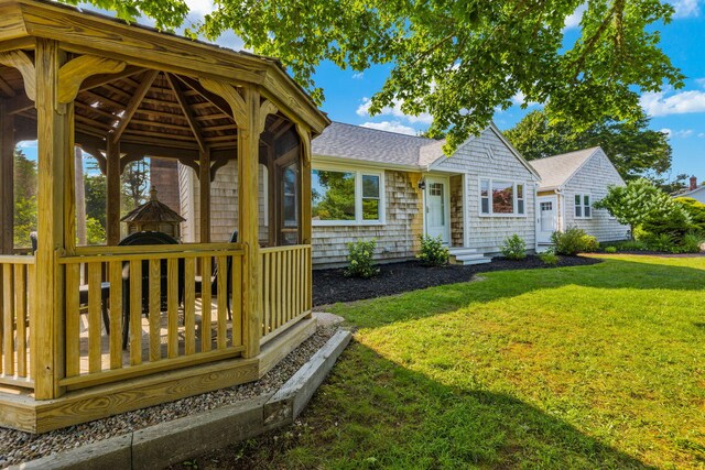 72 Forest Beach Rd, South Chatham, MA 02659 - view of front of home featuring a gazebo, a front yard, and roof with shingles