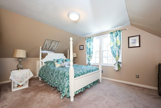 carpeted bedroom featuring vaulted ceiling