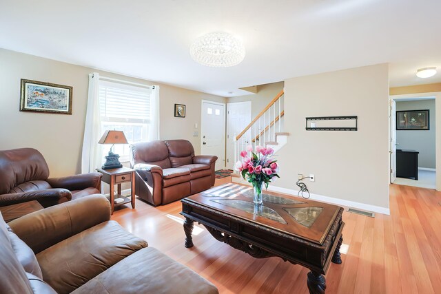 living room with light hardwood / wood-style floors