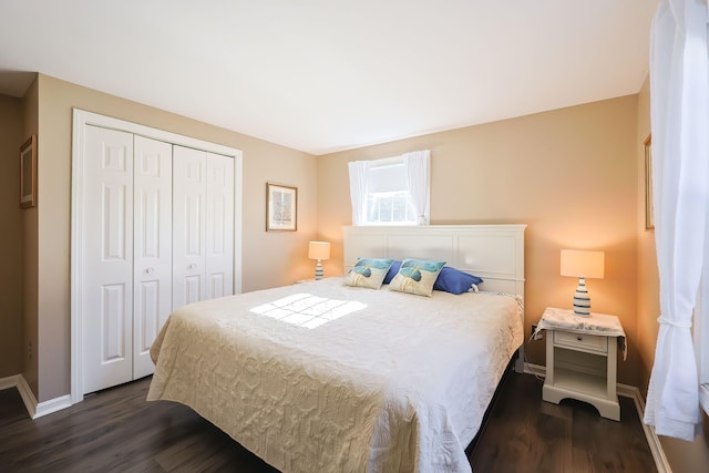 bedroom featuring dark hardwood / wood-style floors and a closet