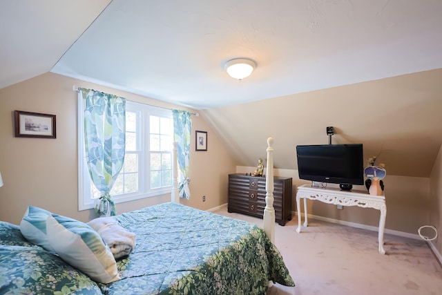 bedroom featuring carpet flooring and vaulted ceiling