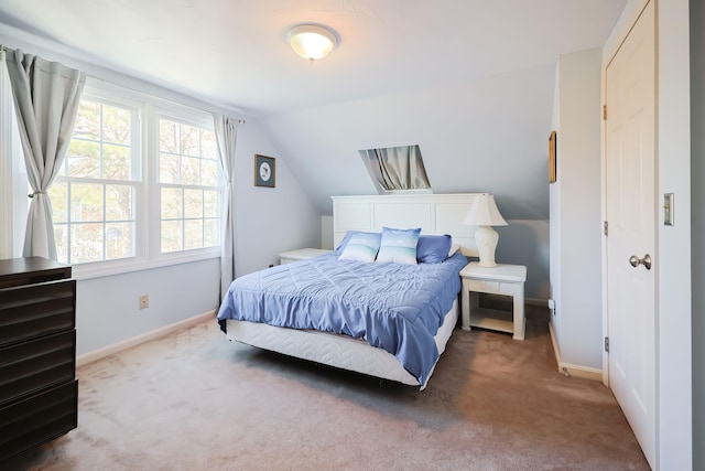 bedroom featuring carpet floors and lofted ceiling