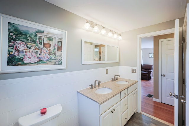 bathroom with toilet and vanity