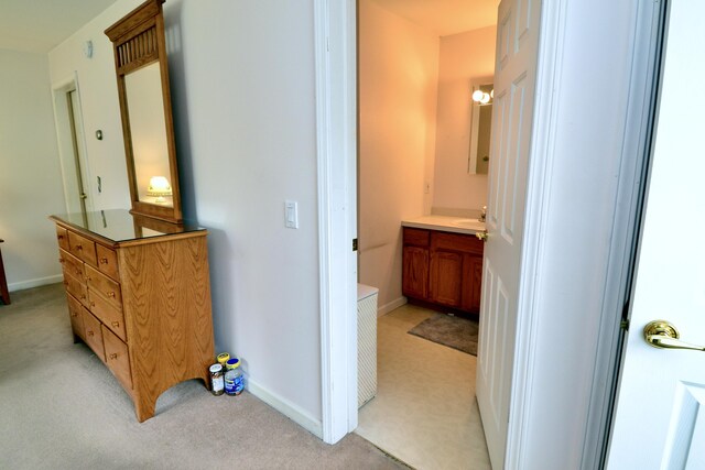 62 Jernegan Ave, Edgartown, MA 02539 - hallway featuring light carpet, a sink, and baseboards