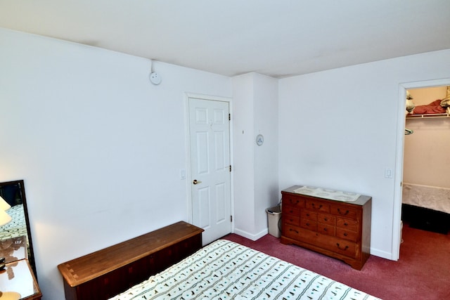 62 Jernegan Ave, Edgartown, MA 02539 - carpeted bedroom featuring a walk in closet and baseboards