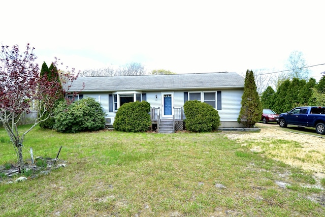 62 Jernegan Ave, Edgartown, MA 02539 - view of front of home with a front lawn and roof with shingles