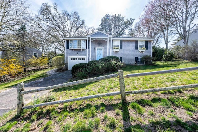 99 Heritage Ln, Chatham, MA 02633 - split foyer home with driveway, an attached garage, and a front yard