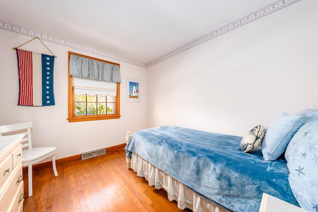 99 Heritage Ln, Chatham, MA 02633 - bedroom with baseboards and light wood-style flooring