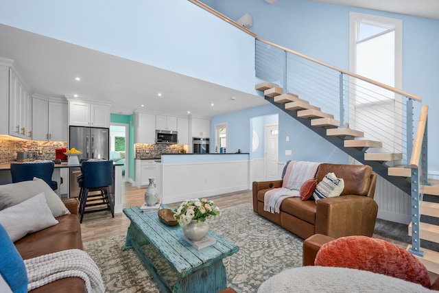 290 Fletcher Ln, Brewster, MA 02631 - living room featuring stairway, light wood-type flooring, and recessed lighting