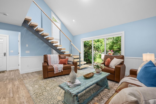 290 Fletcher Ln, Brewster, MA 02631 - living room featuring wood finished floors, stairs, wainscoting, and vaulted ceiling