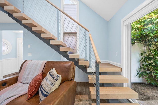 290 Fletcher Ln, Brewster, MA 02631 - stairway with wood finished floors, vaulted ceiling, and wainscoting