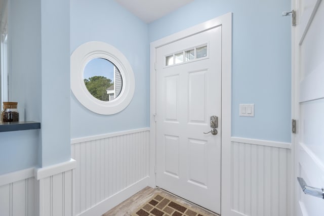 290 Fletcher Ln, Brewster, MA 02631 - entrance foyer with wainscoting and light wood-style floors