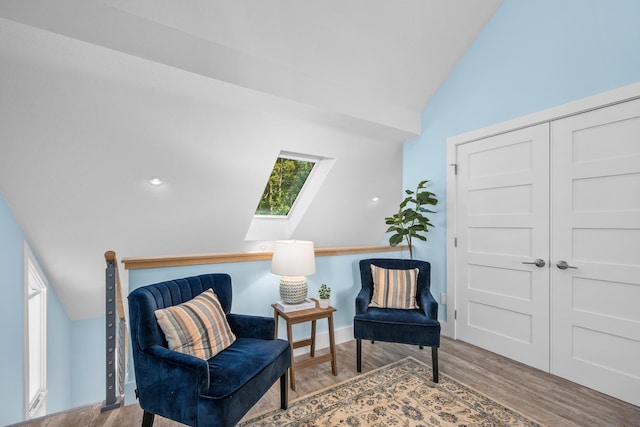 290 Fletcher Ln, Brewster, MA 02631 - sitting room featuring a skylight, lofted ceiling, and wood finished floors