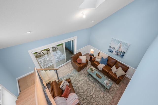 290 Fletcher Ln, Brewster, MA 02631 - living area featuring a skylight, wood finished floors, and lofted ceiling