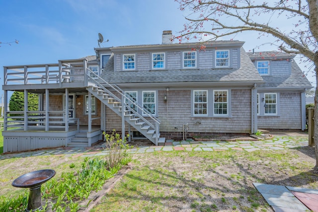 402 Old Wharf Rd, Dennis Port, MA 02639 - back of house with a chimney, a deck, roof with shingles, and stairs