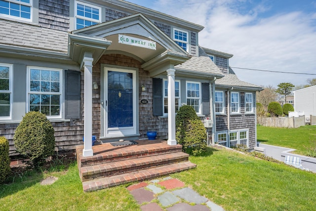 402 Old Wharf Rd, Dennis Port, MA 02639 - property entrance with a shingled roof and a yard
