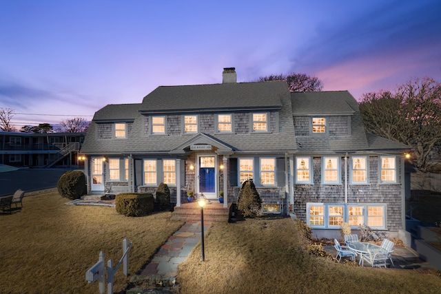 402 Old Wharf Rd, Dennis Port, MA 02639 - view of front facade with a chimney, a yard, and a shingled roof