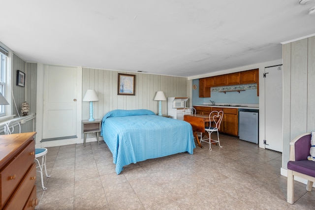 bedroom featuring white built in refrigerator