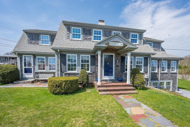 402 Old Wharf Rd, Dennis Port, MA 02639 - view of front of home with a chimney, a shingled roof, and a front lawn