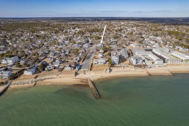 birds eye view of property featuring a water view, a residential view, and a view of the beach