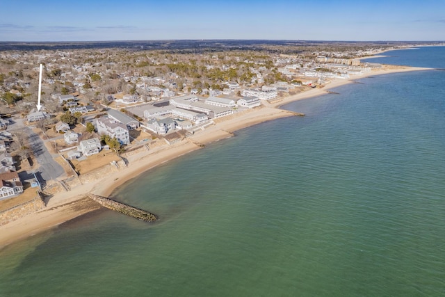 birds eye view of property featuring a water view and a view of the beach