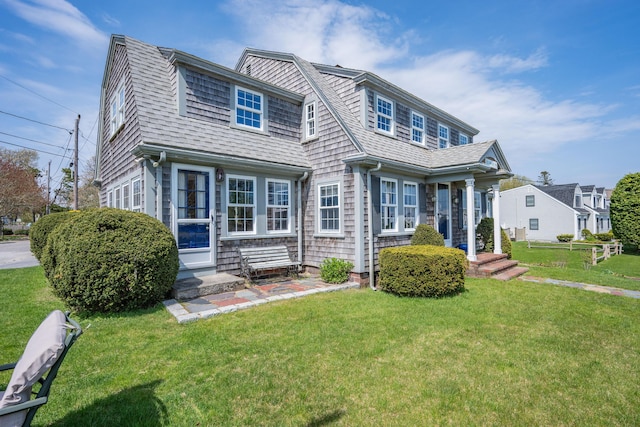 402 Old Wharf Rd, Dennis Port, MA 02639 - shingle-style home featuring a shingled roof, a front yard, and entry steps