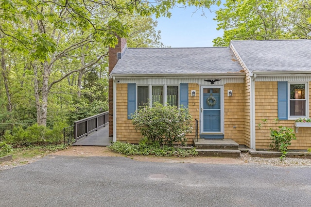 51 Wianno Cir, Osterville, MA 02655 - view of front of house with a chimney and roof with shingles
