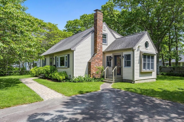 22 Emerson Rd, East Falmouth, MA 02536 - view of front of home featuring a chimney and a shingled roof