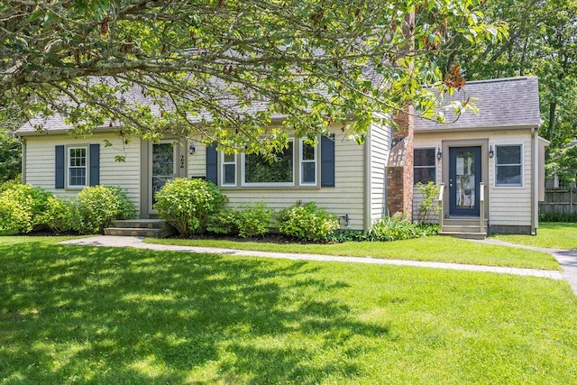 22 Emerson Rd, East Falmouth, MA 02536 - view of front facade featuring a front lawn, entry steps, and a shingled roof