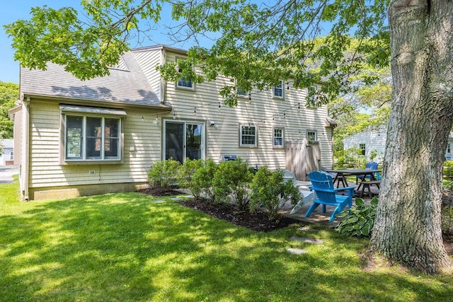 22 Emerson Rd, East Falmouth, MA 02536 - back of property featuring a yard