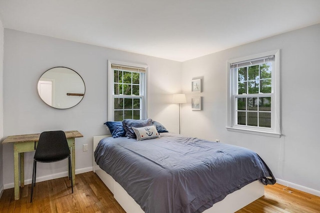 22 Emerson Rd, East Falmouth, MA 02536 - bedroom with multiple windows and wood finished floors