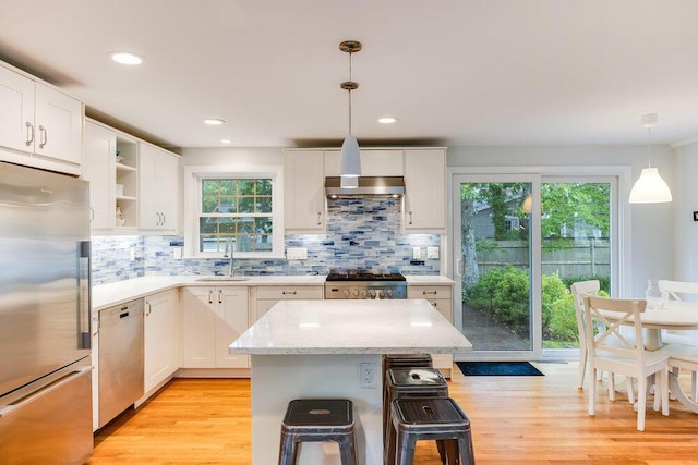 22 Emerson Rd, East Falmouth, MA 02536 - kitchen with appliances with stainless steel finishes, white cabinetry, decorative backsplash, open shelves, and recessed lighting
