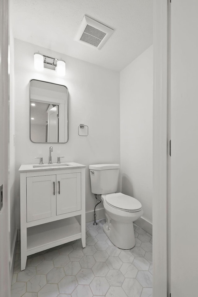 176 Palmer Ave Unit 2, Falmouth, MA 02540 - half bath featuring vanity and tile patterned floors