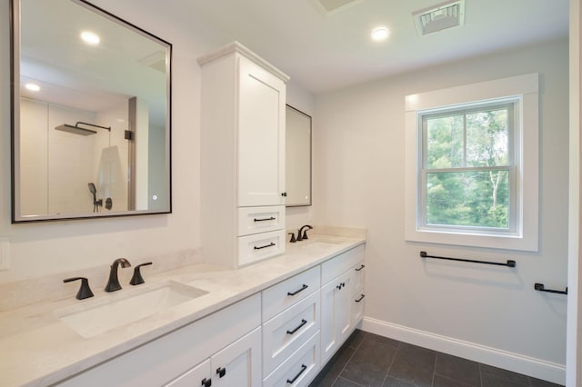 73 Tern Ln, Centerville, MA 02632 - full bath featuring double vanity, tile patterned floors, a tile shower, and recessed lighting