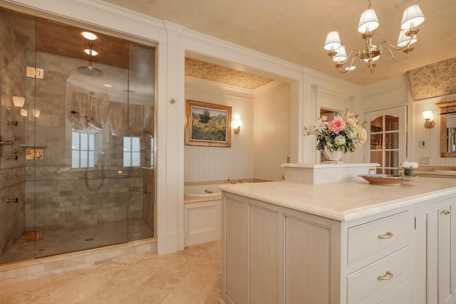 bathroom with a shower stall, ornamental molding, a bath, vanity, and a notable chandelier