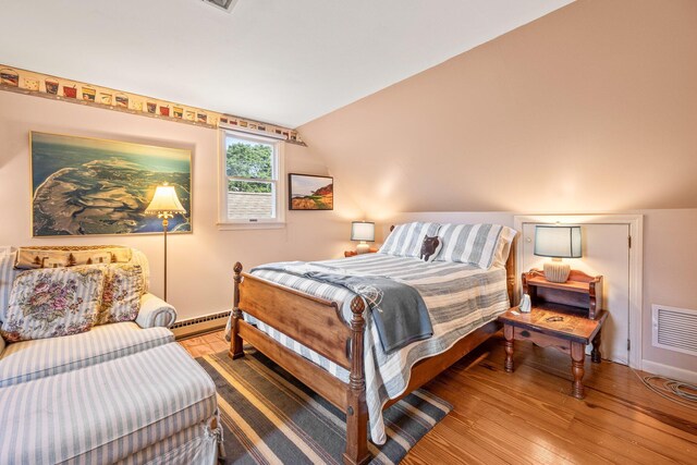 319 Riverview Dr, Chatham, MA 02633 - bedroom featuring lofted ceiling, wood finished floors, and baseboard heating