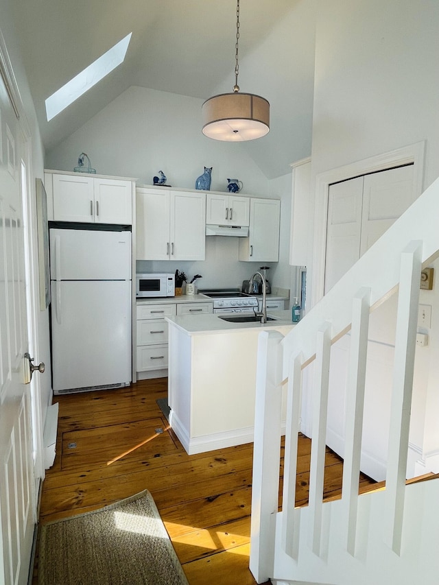 16 Hydrangea Ln, Mashpee, MA 02649 - kitchen with white appliances, lofted ceiling, a skylight, dark wood-style flooring, and under cabinet range hood