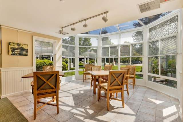 110 Dillingham Ave Unit 212U, Falmouth, MA 02540 - sunroom with track lighting and outdoor dining area