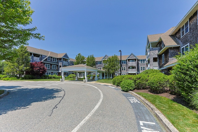 110 Dillingham Ave Unit 212U, Falmouth, MA 02540 - view of asphalt road featuring curbs, street lighting, and a residential view