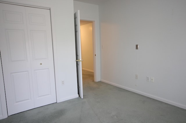 110 Dillingham Ave Unit 212U, Falmouth, MA 02540 - unfurnished bedroom featuring carpet and a closet