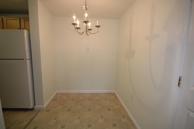 110 Dillingham Ave Unit 212U, Falmouth, MA 02540 - unfurnished dining area with a chandelier and light flooring