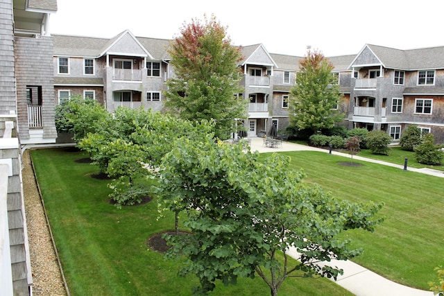 110 Dillingham Ave Unit 212U, Falmouth, MA 02540 - view of property's community featuring a yard and a patio